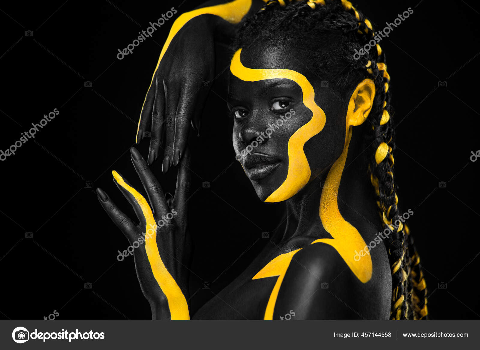 Yellow and black body paint. Woman with face art. Young girl with colorful  bodypaint. An amazing afro american model with makeup. Stock Photo by  ©MikeOrlov 457144558