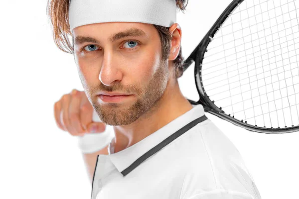 Tennis player with racket in white costume. Man athlete playing isolated on light background. — Stock Photo, Image