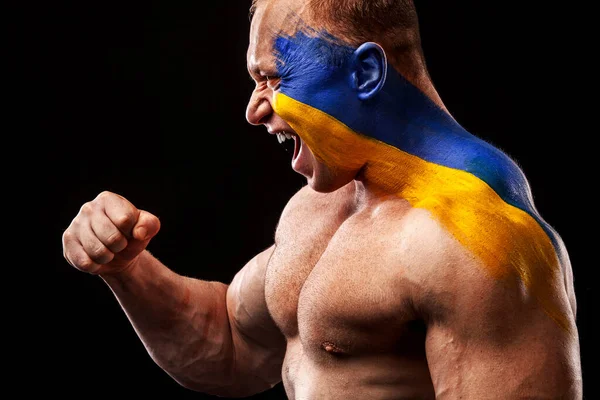Fan dell'Ucraina. Calcio o atleta di calcio con bandiera bodyart sul viso. Concetto sportivo con copyspace. — Foto Stock