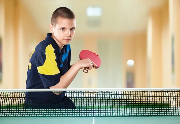 Little boy tennis-player in play. Action shot. — Stock Photo, Image