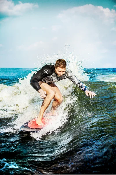 Surfing at blue sea. Young man touched wave on surfboard. — Stock Photo, Image