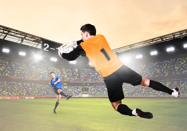 Goalkeeper is catching ball — Stock Photo, Image
