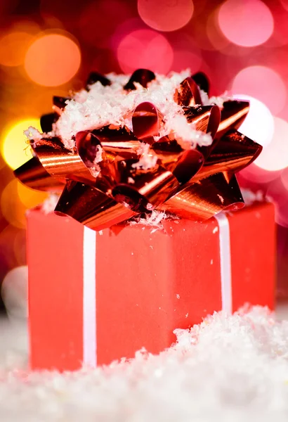 Red gift box on snow — Stock Photo, Image