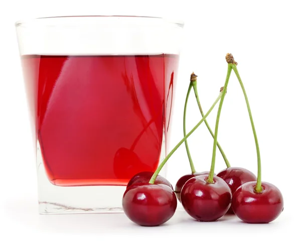 Wiśnie i szklanka soku wiśniowego — Zdjęcie stockowe
