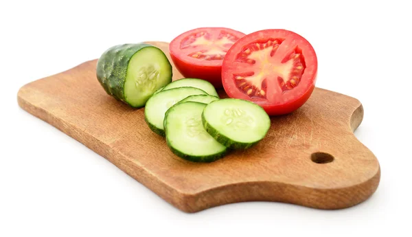 Tomato and cucumber on the board. — Stockfoto