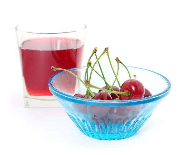 Cerejas e um copo de suco de cereja — Fotografia de Stock