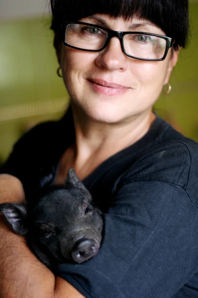 Woman with a pig — Stock Photo, Image