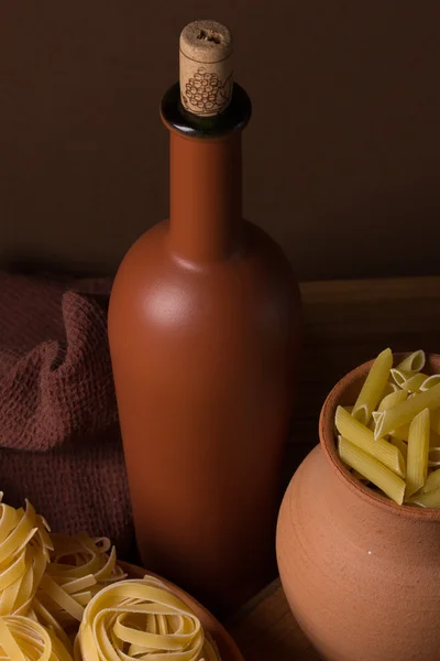 Still life with pasta and ceramic ware — Stock Photo, Image