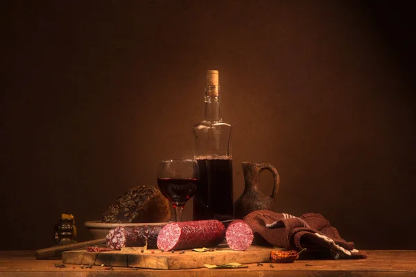 Still life with wine and sausage — Stock Photo, Image