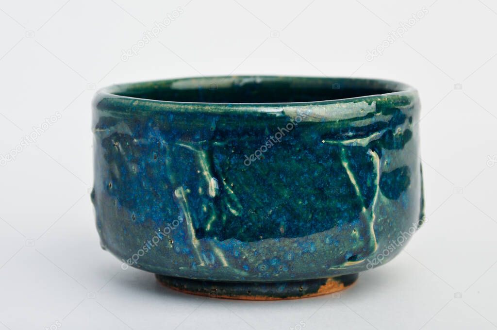 Green and blue japanese handmade pottery cup. Japanese traditional tea cup