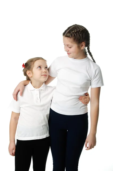 Little girls hugs on white — Stock Photo, Image