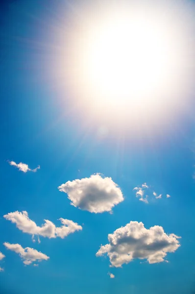 Sun in a bright blue sky Stock Image