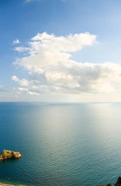 Blue sky with clouds over sea. — Stock Photo, Image