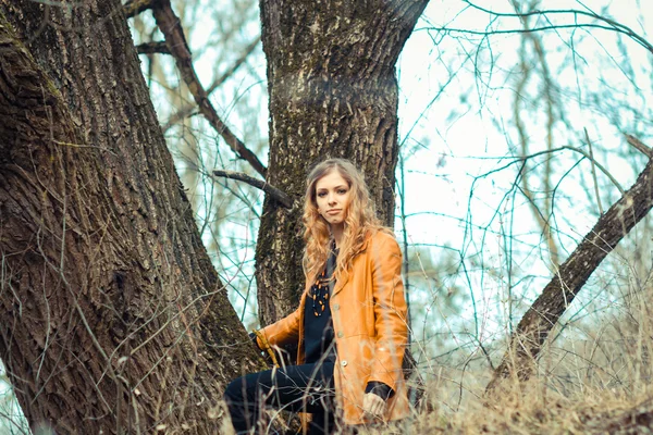 Girl hipster among the trees — Stock Photo, Image