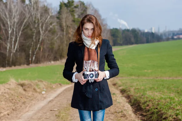 Hipster girl with retro camera outdoors — Stock Photo, Image