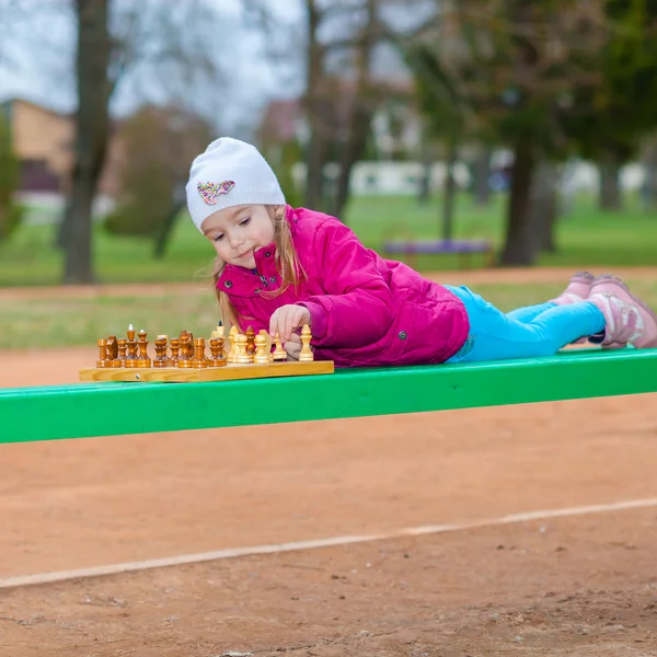 Little girl playing chess — Stock Photo, Image