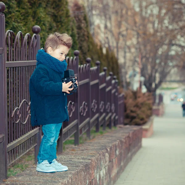 Boy with retro camera — Stock Photo, Image