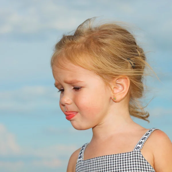 Sad little girl with blond hair — Stock Photo, Image