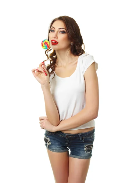 黑发女人拿着一根棒棒糖 — 图库照片