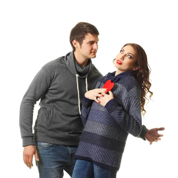 Couple having fun with a paper heart — Stock Photo, Image