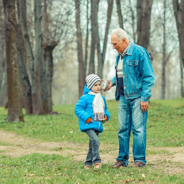 Grandfather showing grandson vintage watches — Stock Photo, Image