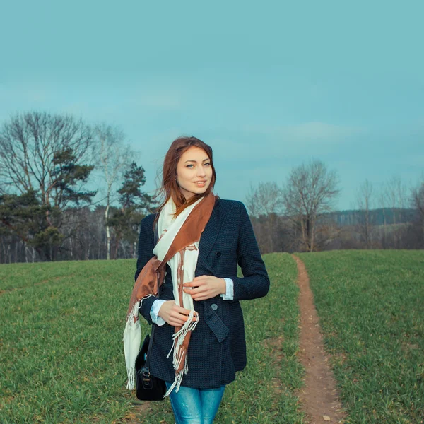 Beautiful lonely girl in field — Stock Photo, Image