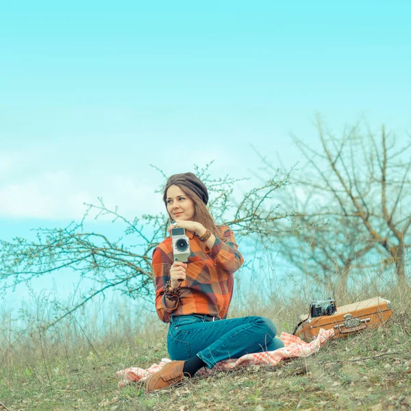 Girl in a plaid shirt  with vintage camera — Stock Photo, Image