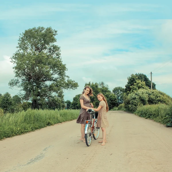 Hipster girls on bicycle — Stock Photo, Image