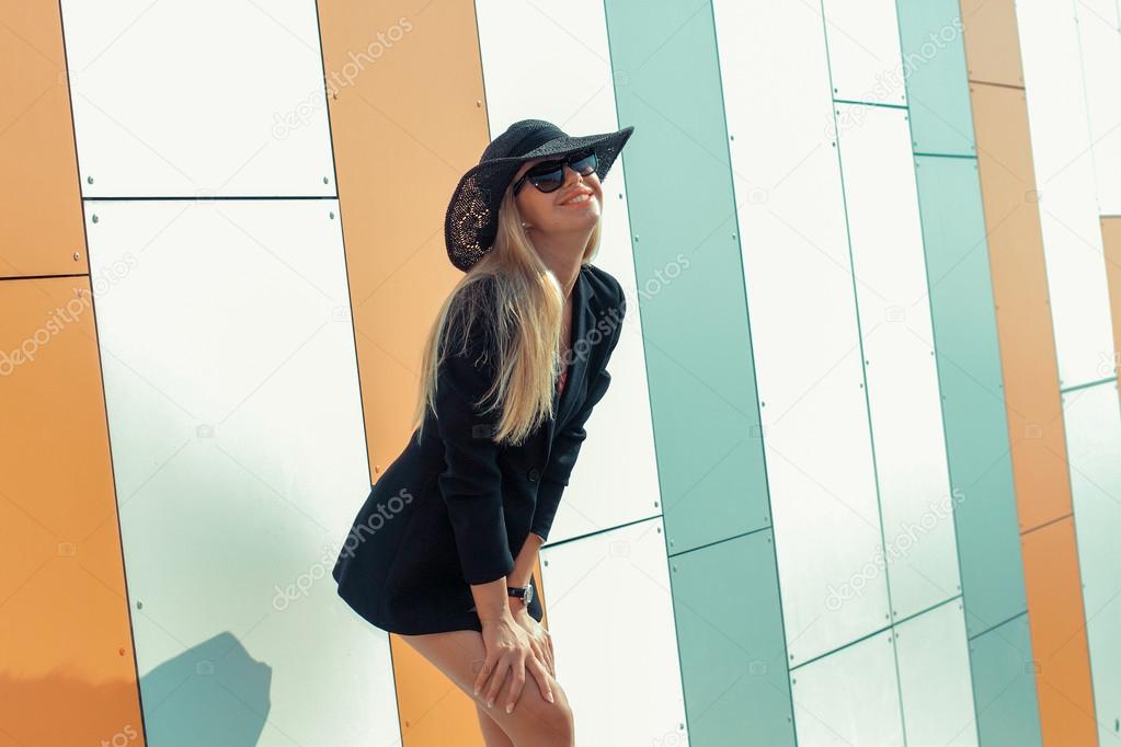Girl in long-skirted hat posing