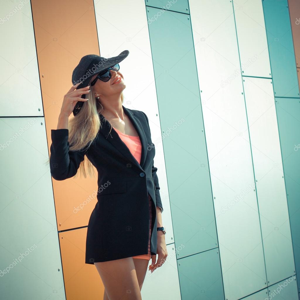 Girl in long-skirted hat posing