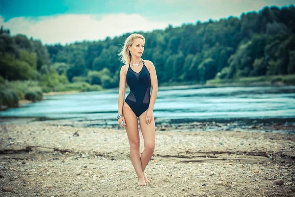 Blond girl posing in swimsuit — Stock Photo, Image