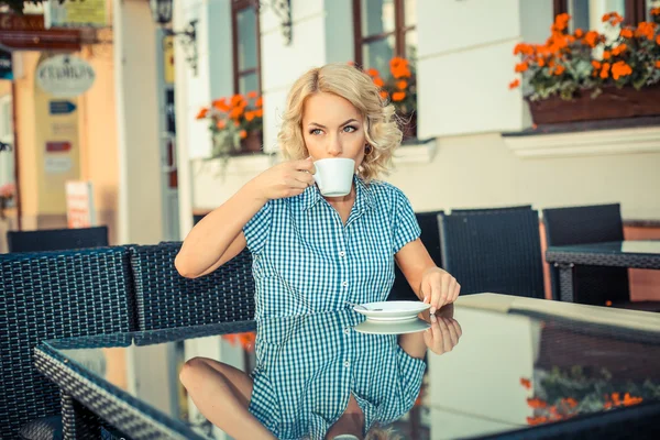 Blond model with cup of coffee — Stockfoto