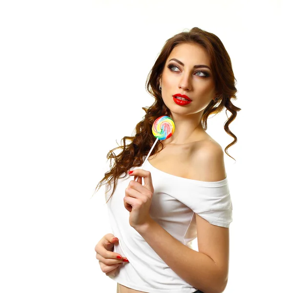 Beautiful woman  holding a candy — Stock Photo, Image