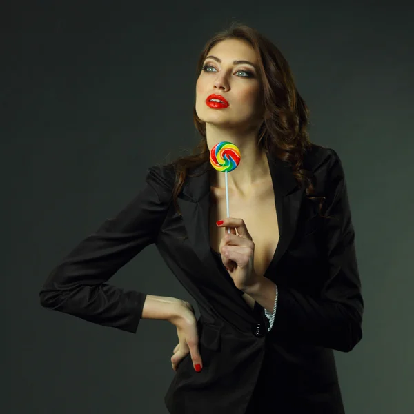 Sexy girl in  jacket with lollipop — Stock Photo, Image