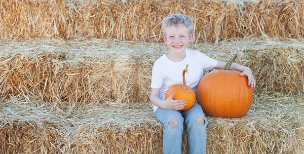 Playful kid with pumpkin — Stock Photo, Image