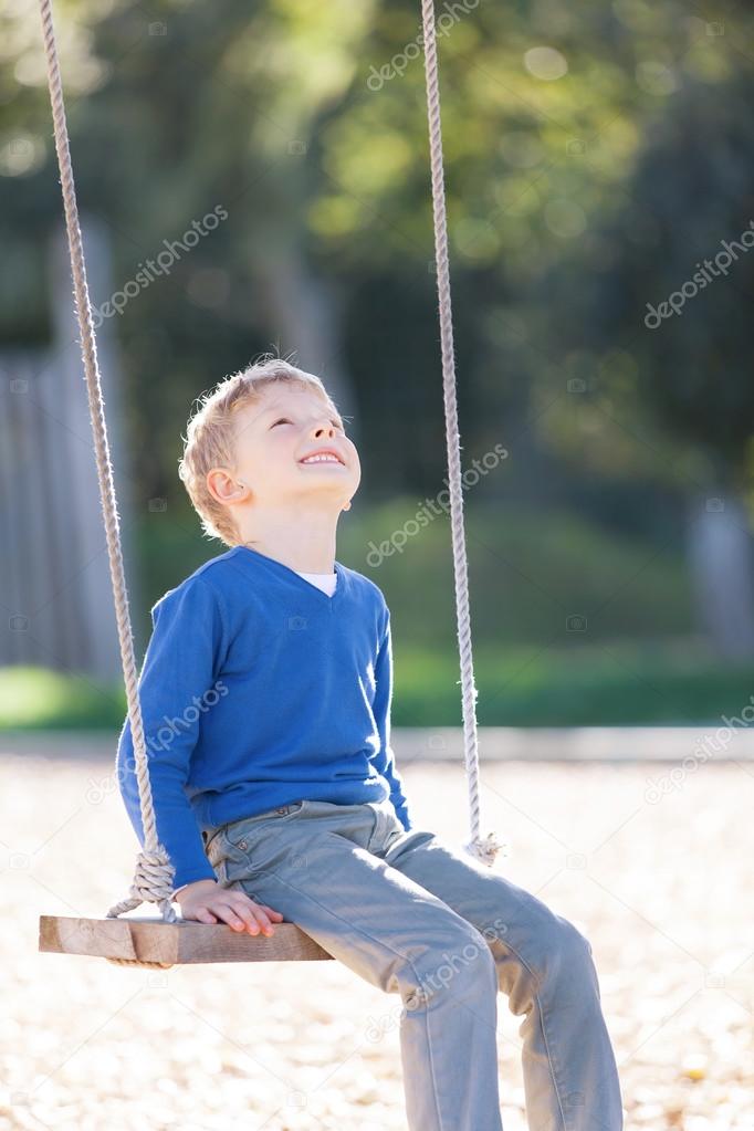 boy at swings