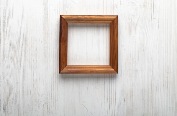 Photo frame on white wall — Stock Photo, Image