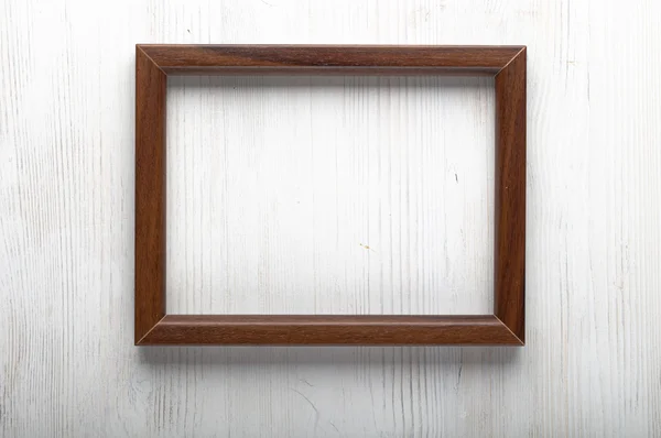 Photo frame on white wall — Stock Photo, Image