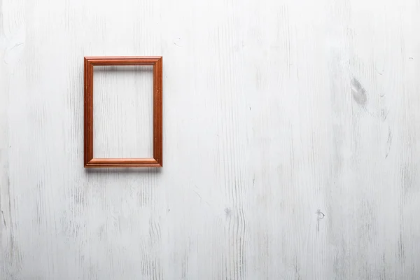 Photo frame on white wall — Stock Photo, Image