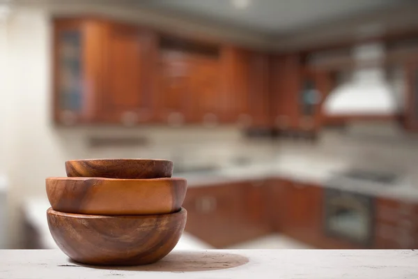 Stack of empty wooden bowls on table — Stock Photo, Image