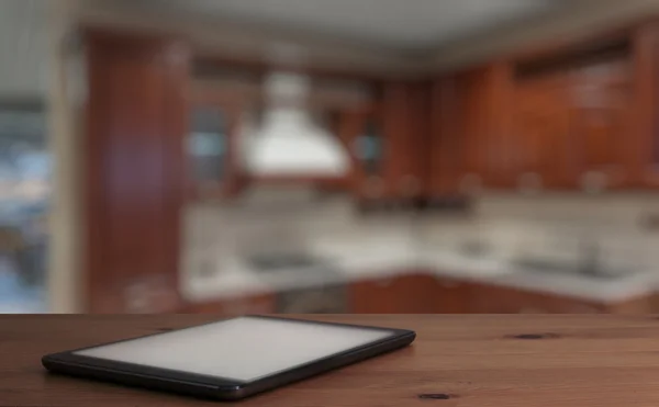 Tablet on wooden table — Stock Photo, Image