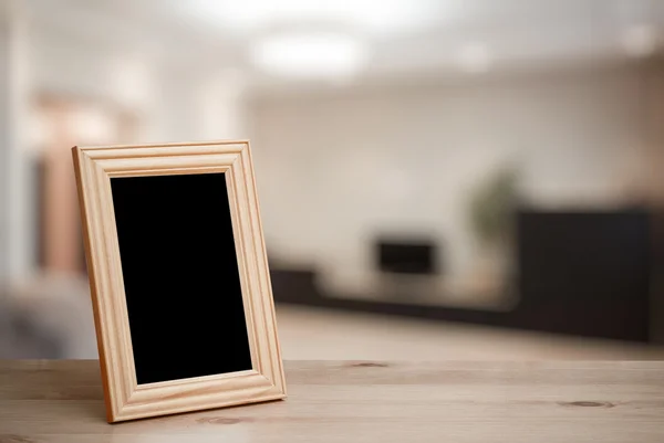 Fotorámeček na dřevěný stůl — Stock fotografie