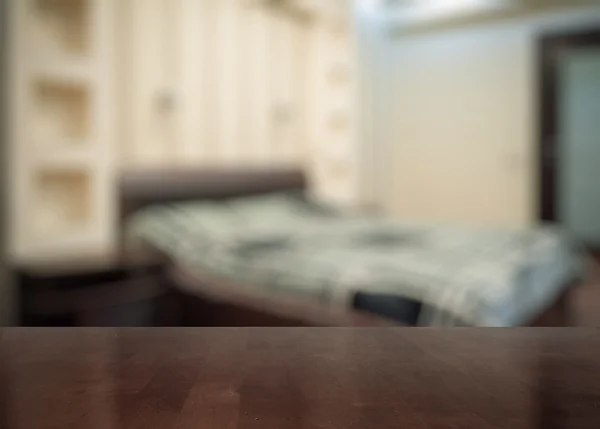 Wooden table in bedroom — Stock Photo, Image