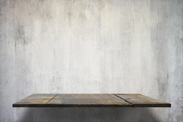 Empty shelves on concrete wall — Stock Photo, Image