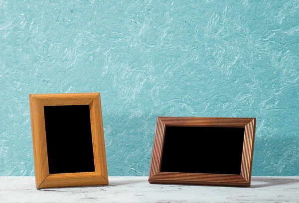 Wooden Photo Frames Table Blue Wall — Stock Photo, Image