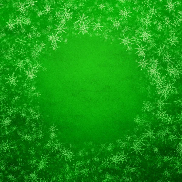 green winter christmas background with snowflakes