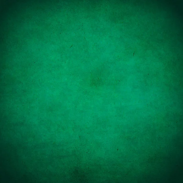古い黒い紙緑の背景 — ストック写真