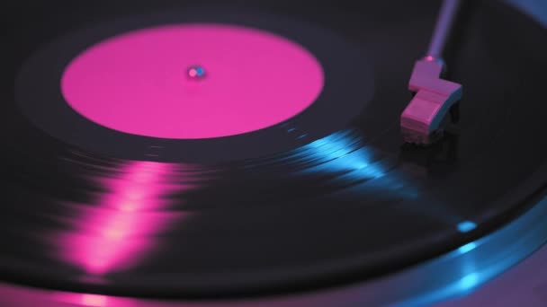 Old retro vinyl record, vintage turntable, neon light. — Stock Footage Old Retro Vinyl Record Vintage Turntable Neon Light — Stock Video