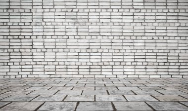 Duvarı tuğlalı ve döşemesi fayanslı boş bir oda. İç arkaplan.