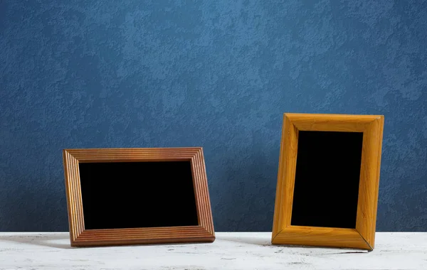 Wooden Photo Frames Table Blue Wall — Stock Photo, Image